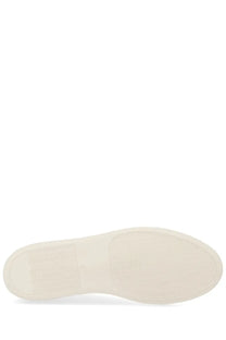 Cream-colored rubber sole with textured grip on common projects men’s sneaker achilles white minimalist design