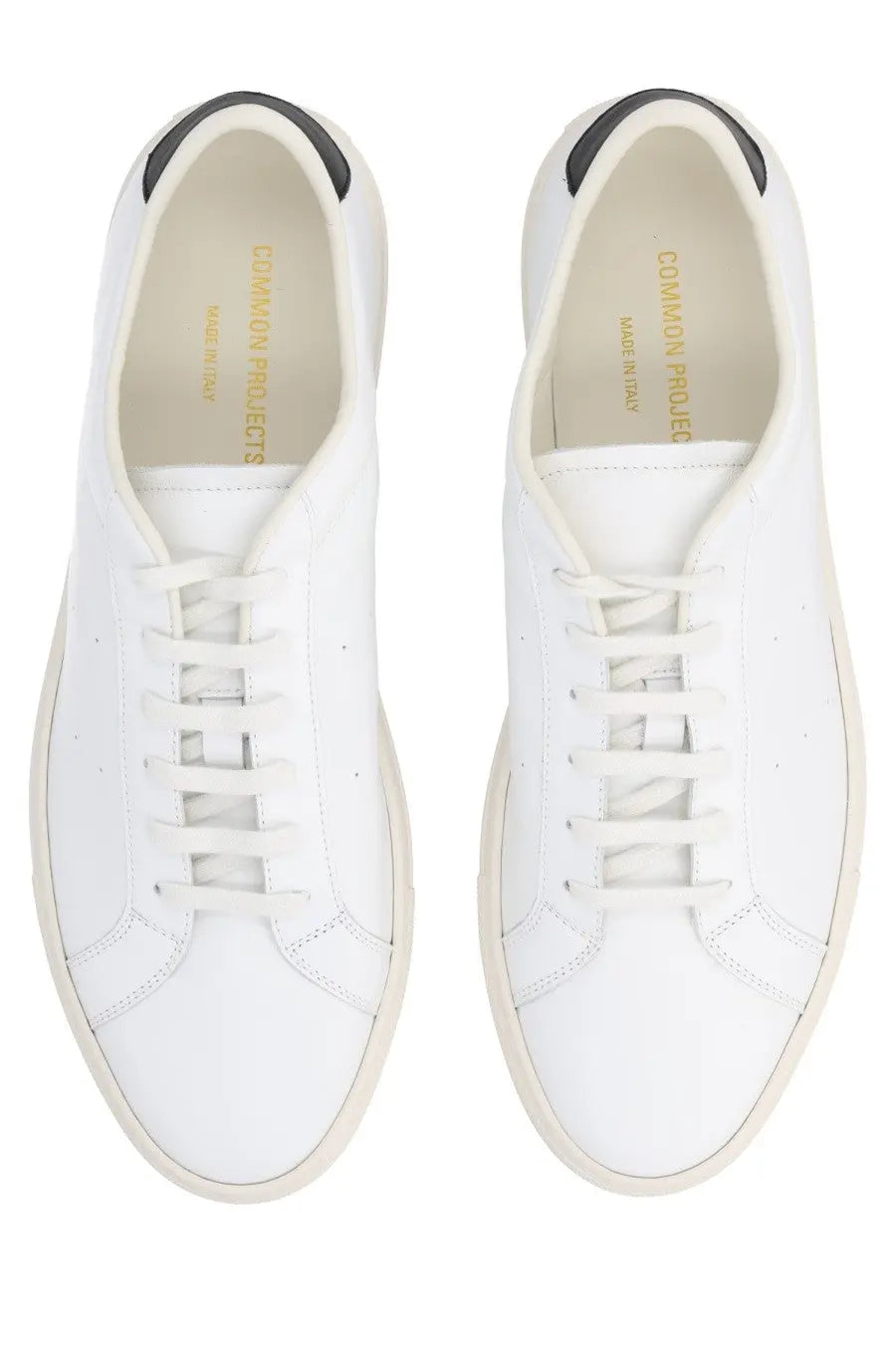 Common projects men’s sneaker achilles white leather with black heel tabs and cream soles in minimalist design