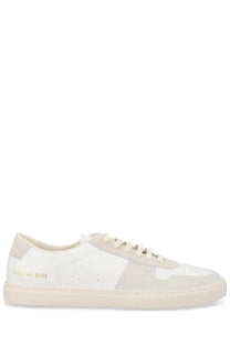 Common projects men’s sneaker bball white low-top sneaker in white and beige suede and leather with gold heel branding back view