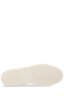 Cream-colored rubber sole of common projects men’s sneaker bball white with smooth minimalist design