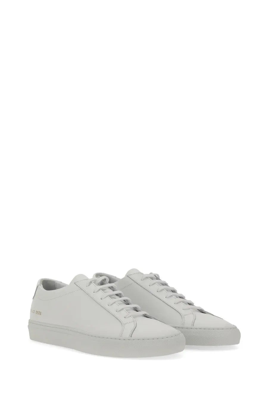 Common Projects men’s low Achilles original white leather low-top sneakers with minimalist design and subtle stitching details