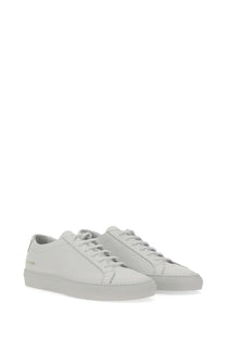 Common Projects men’s low Achilles original white leather low-top sneakers with minimalist design and subtle stitching details