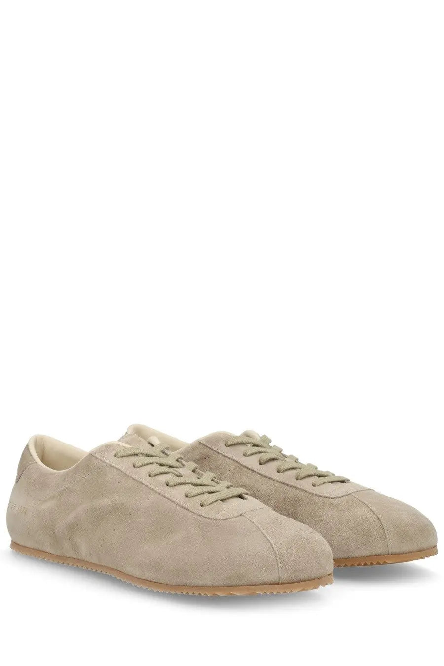 Common Projects men’s sneaker in beige suede with matching laces and light brown rubber sole low-top design