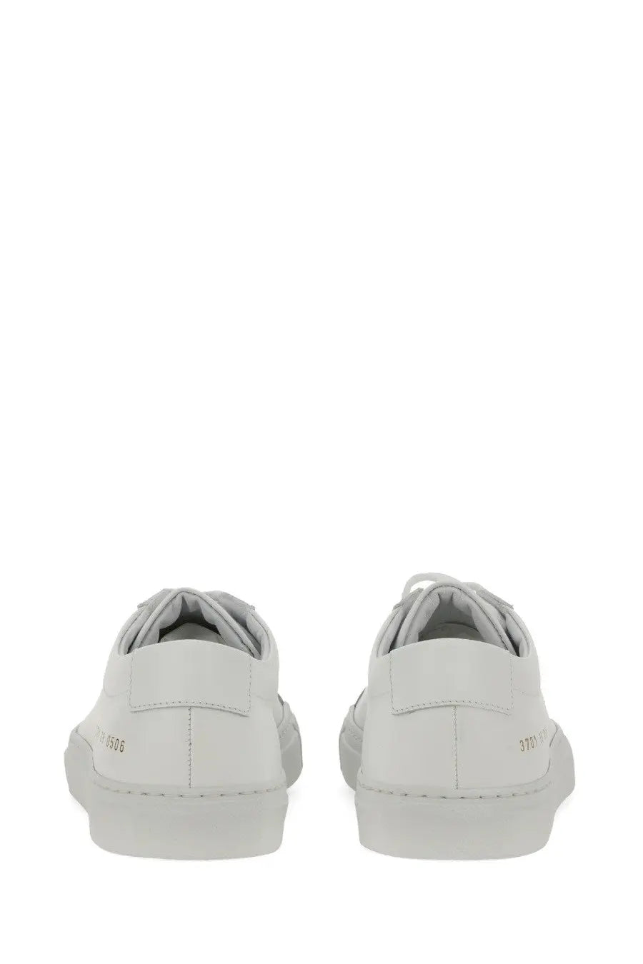 Common projects women’s low original achilles sneaker white leather low-top with minimalist design and subtle heel branding shown from back