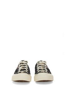 Converse men’s Chuck Taylor sneaker black low-top canvas with cream laces and thick off-white rubber sole