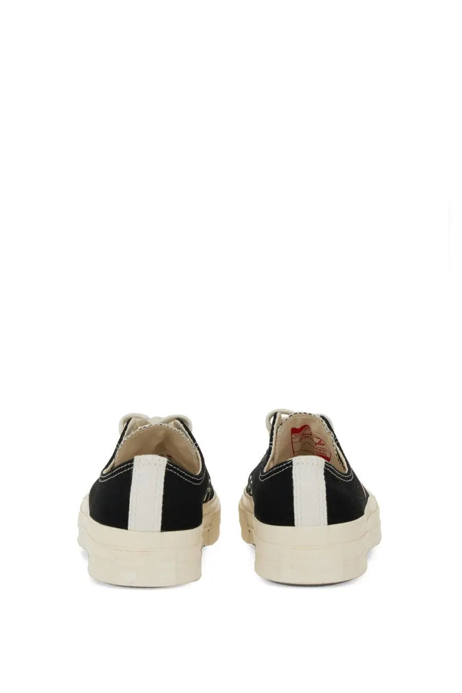 Converse men’s chuck taylor sneaker black showing the back with black canvas, white heel stripe, and cream rubber soles