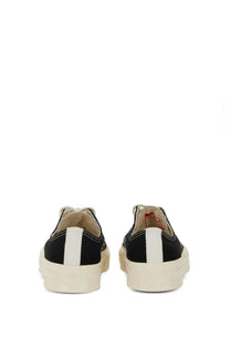Converse men’s chuck taylor sneaker black showing the back with black canvas, white heel stripe, and cream rubber soles