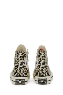 Cream-colored Converse unisex Chuck high top sneaker with bold leopard print canvas upper in multicolor design