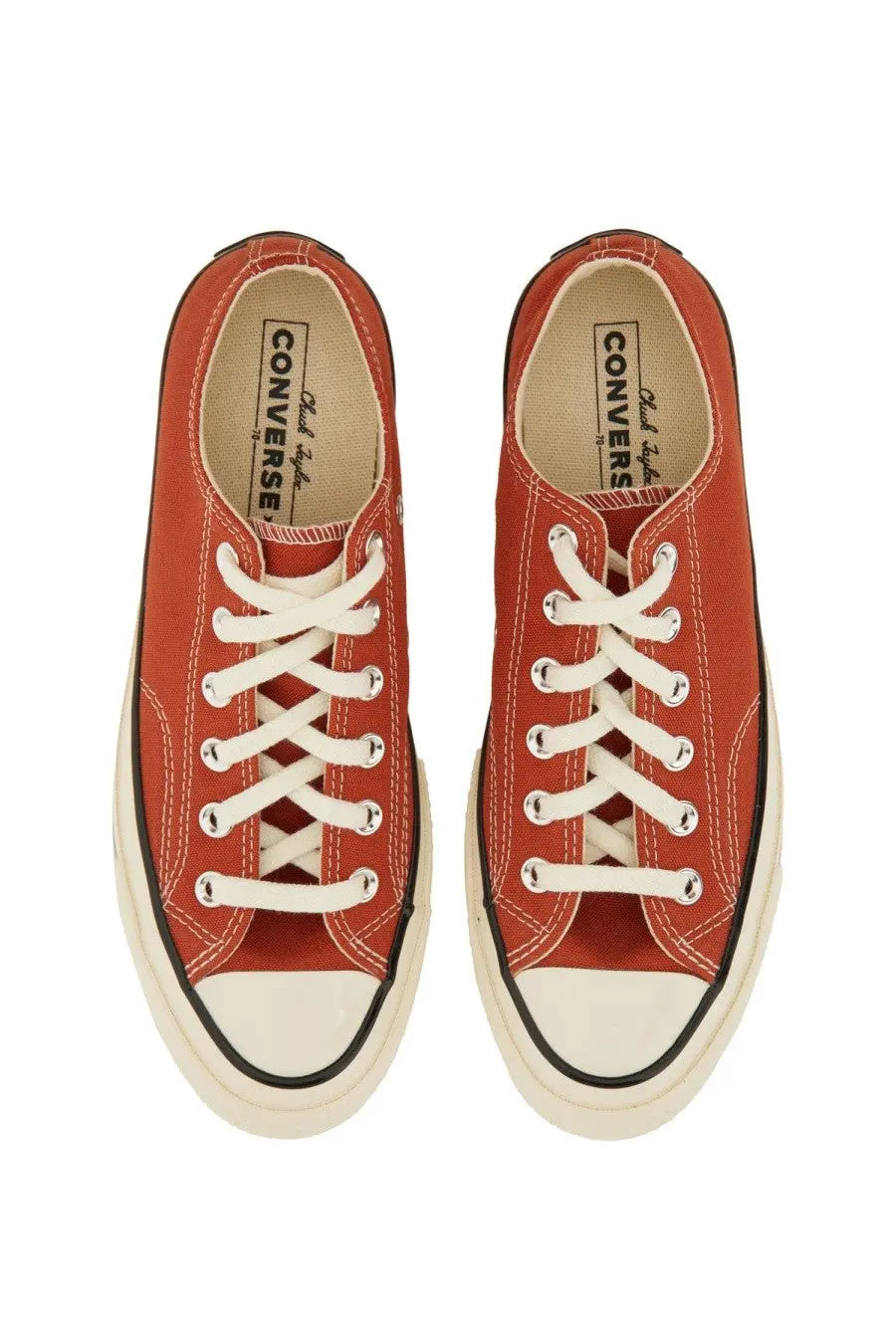 Red canvas Converse unisex Chuck OX sneaker with white laces and rubber toe cap for casual wear