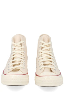 Converse unisex chuck sneaker beige cream canvas high-top with red rubber soles and matching laces featuring classic branding