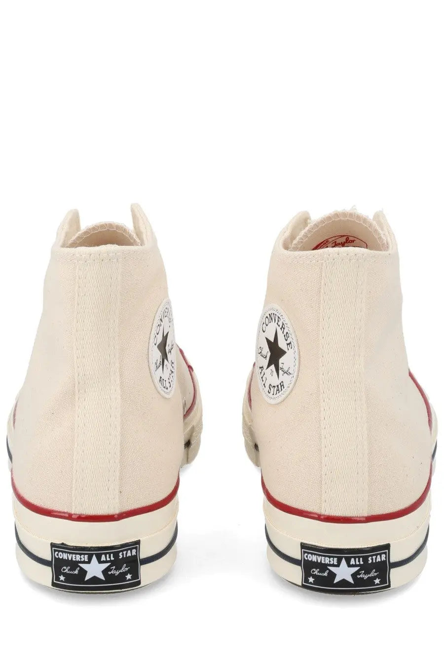 Converse unisex chuck sneaker beige cream canvas high tops with red rubber soles and black star logo patches