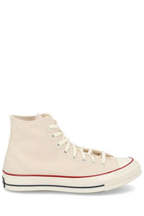 Converse unisex chuck sneaker beige cream-colored canvas high-top with red and black rubber sole trim