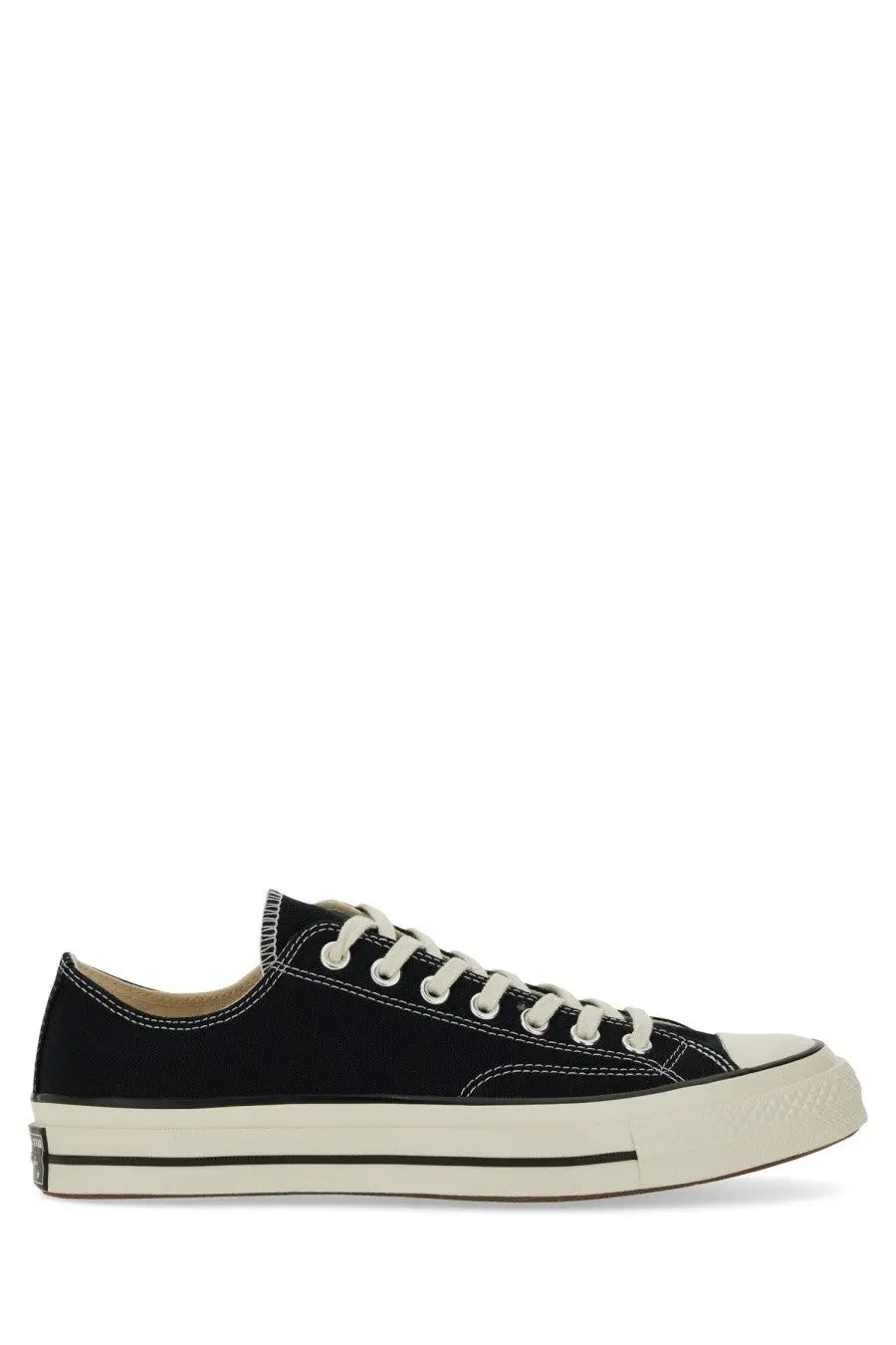 Converse unisex chuck sneaker black low-top canvas with white laces and cream rubber sole and toe cap
