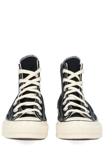 Converse unisex chuck sneaker black high-top with white laces and cream rubber sole for casual wear