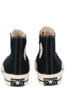 Black high-top Converse Unisex Chuck sneaker with white stitching and rubber soles made of canvas material