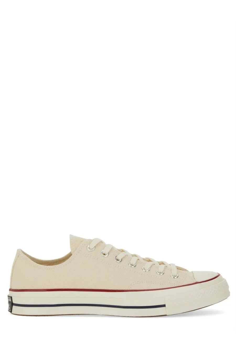 Converse unisex chuck sneaker white cream-colored canvas low-top with red and black rubber sole details