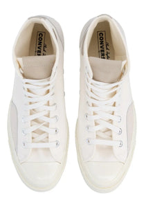 White Converse unisex Chuck Taylor All Star high-top sneakers with clean minimalist design and silver eyelets
