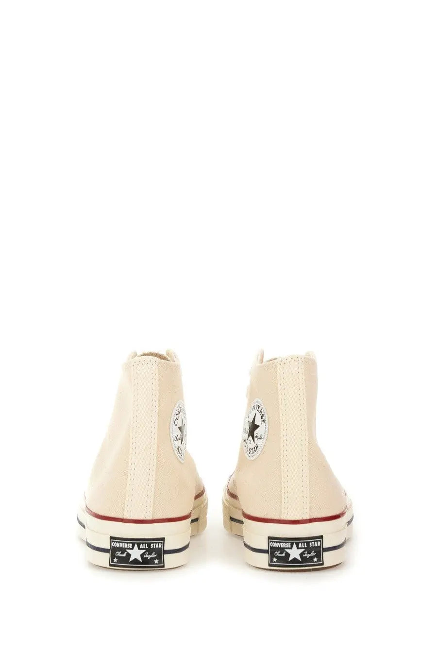 Cream-colored converse unisex chuck vintage sneaker high-top with classic rubber soles and black star logo patches