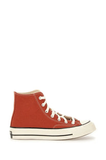 Red canvas high-top Converse unisex Chuck Vintage sneaker with white laces and black rubber sole stripe