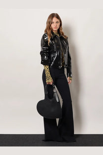Black heart-shaped handbag with silver-toned buckle and handle paired with coperni women’s knitted second skin viscose top