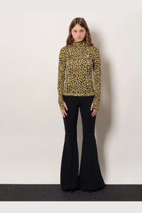 A mustard yellow leopard print knitted viscose long sleeve turtleneck top by Coperni with a small chest logo