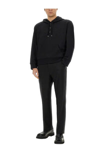 Black courrèges men’s hoodie with button closure drawstring and relaxed fit in a comfortable fabric