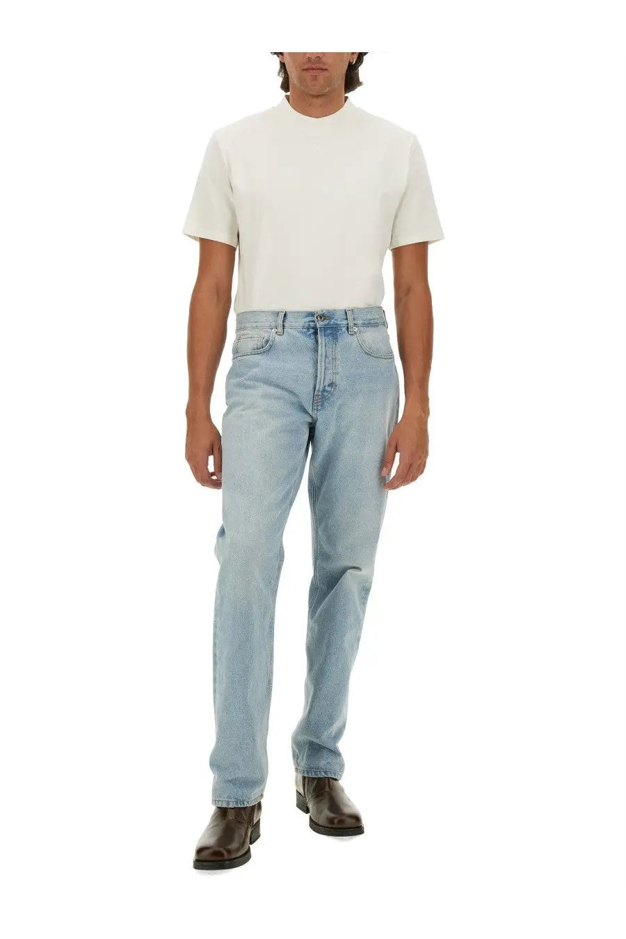 Light-wash denim jeans with classic straight-leg cut and visible stitching paired with courrèges men’s white shirt