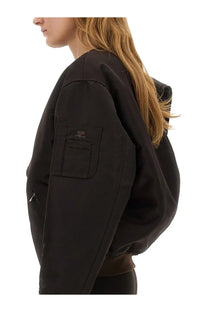 Courrèges women’s brown bow neck bomber jacket with hood and patch pocket on left sleeve featuring subtle stitching