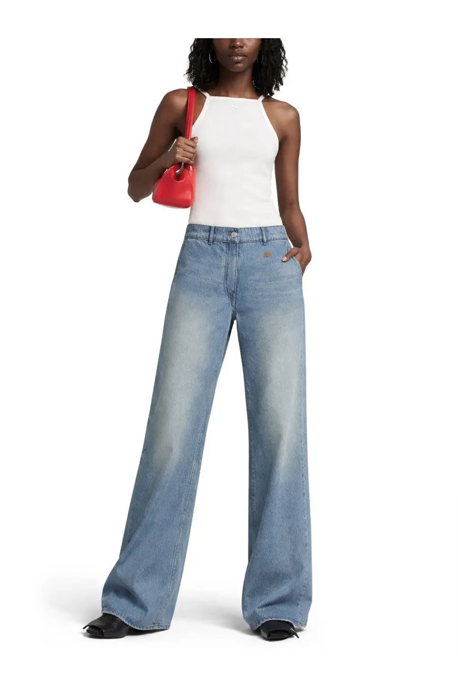 Light-wash denim wide-leg jeans with a relaxed straight cut paired with courrèges women’s contrasting white tank top