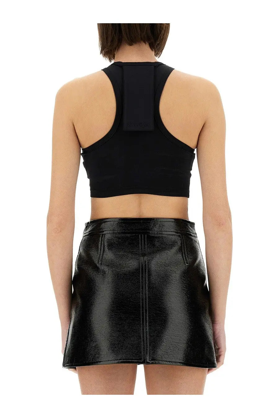 Courrèges women’s black patent leather mini skirt with central front seam and two side pockets