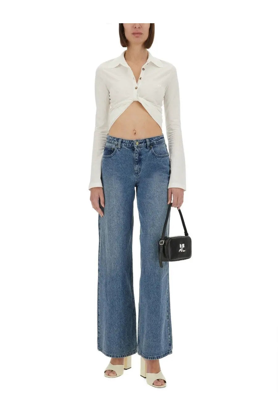 Black mini crossbody bag with silver logo and adjustable strap paired with courrèges women’s cropped white polo shirt