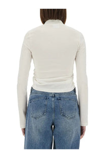 Cream-colored courrèges women’s cropped polo shirt with long sleeves high collar and subtle ruching at the waist