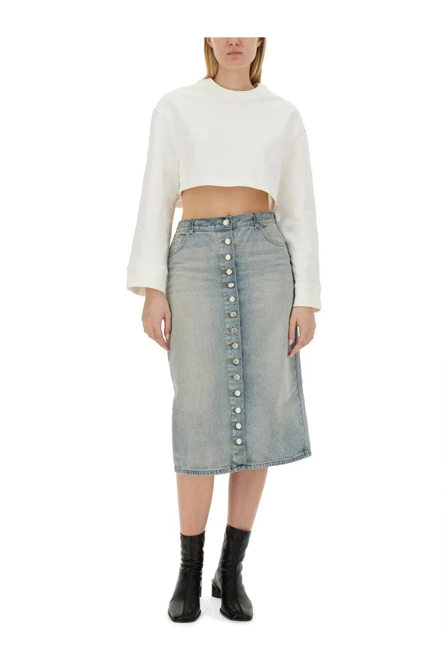 Light-wash denim midi skirt with central button closure and subtle fading paired with courrèges white cropped sweatshirt