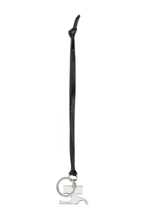 Courrèges women’s black leather keychain with silver metal charm featuring an abstract geometric design