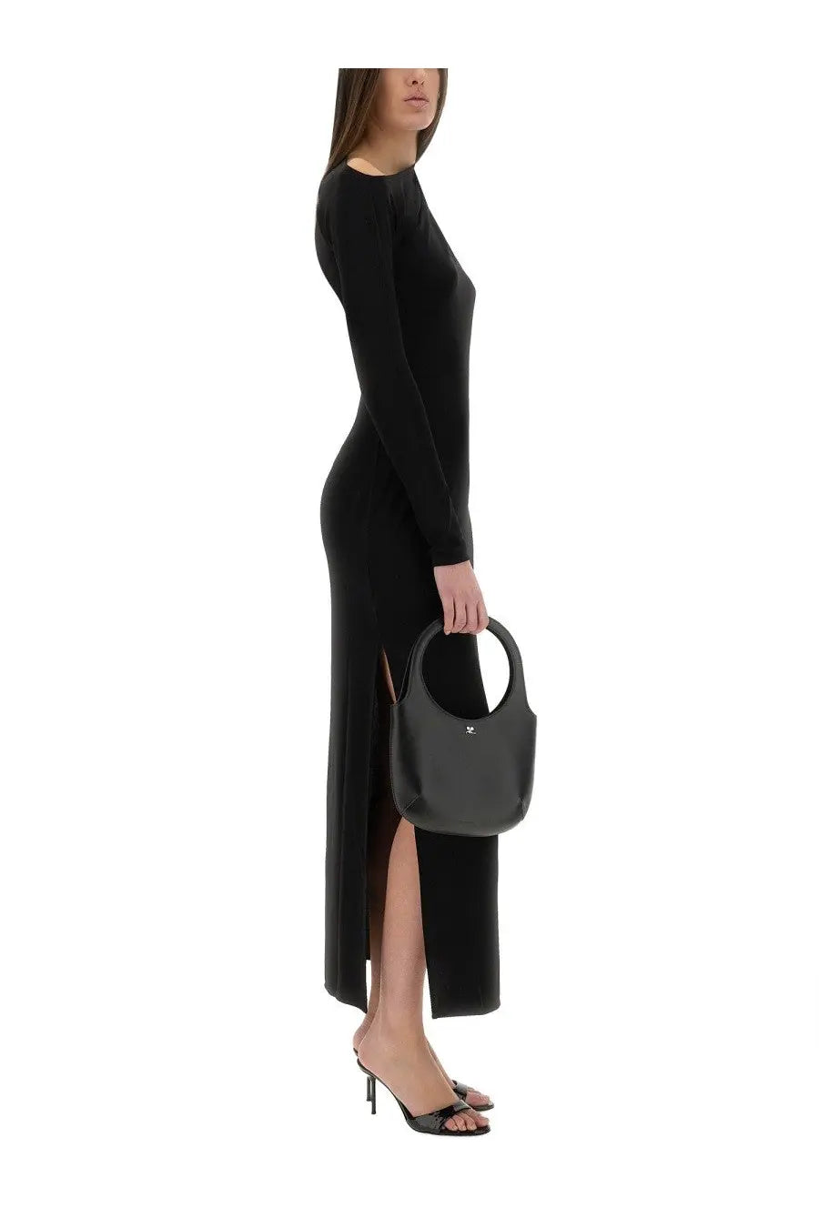 Black leather handbag with circular top handle and minimalist logo detail shown with courrèges women’s long black shoulder dress