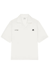White short-sleeved polo shirt with black embroidered branding on chest and collar by courrèges women
