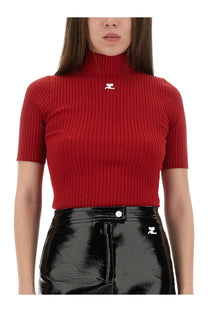 Courrèges women’s red ribbed knitted short sleeve turtleneck top with white logo on the chest