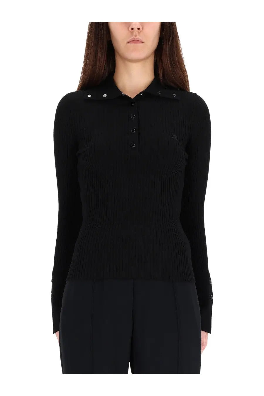 Black ribbed knit polo shirt with buttoned collar and cuffs featuring subtle courrèges branding on the chest