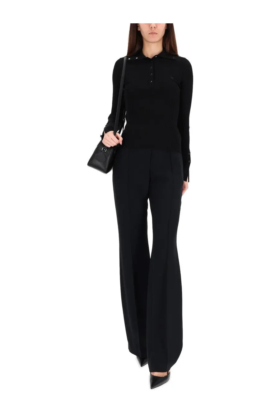 Black long-sleeved ribbed knit top with buttoned collar and subtle embellishments from courrèges women’s polos