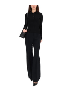 Black long-sleeved ribbed knit top with buttoned collar and subtle embellishments from courrèges women’s polos