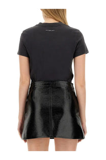 Courrèges women’s black patent leather mini skirt with central front zipper and subtle seam detailing