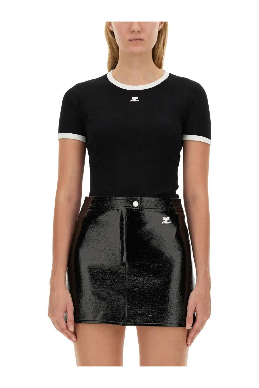 Courrèges women’s black short-sleeved top with white ribbed trim and logo paired with patent leather mini skirt with zipper