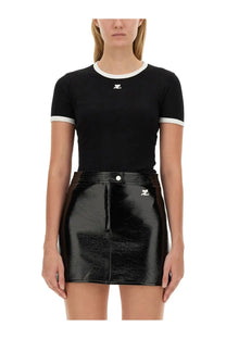 Courrèges women’s black short-sleeved top with white ribbed trim and logo paired with patent leather mini skirt with zipper