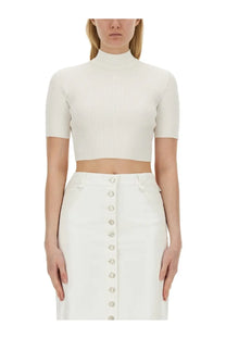 A courrèges women’s white ribbed crop top with short sleeves and a high neckline made from soft fabric
