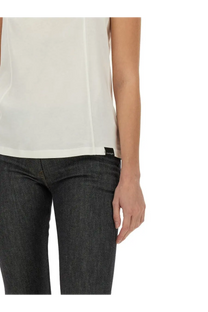 Courrèges women’s sleeveless off-white blouse with subtle sheen lightweight fabric and clean hemline
