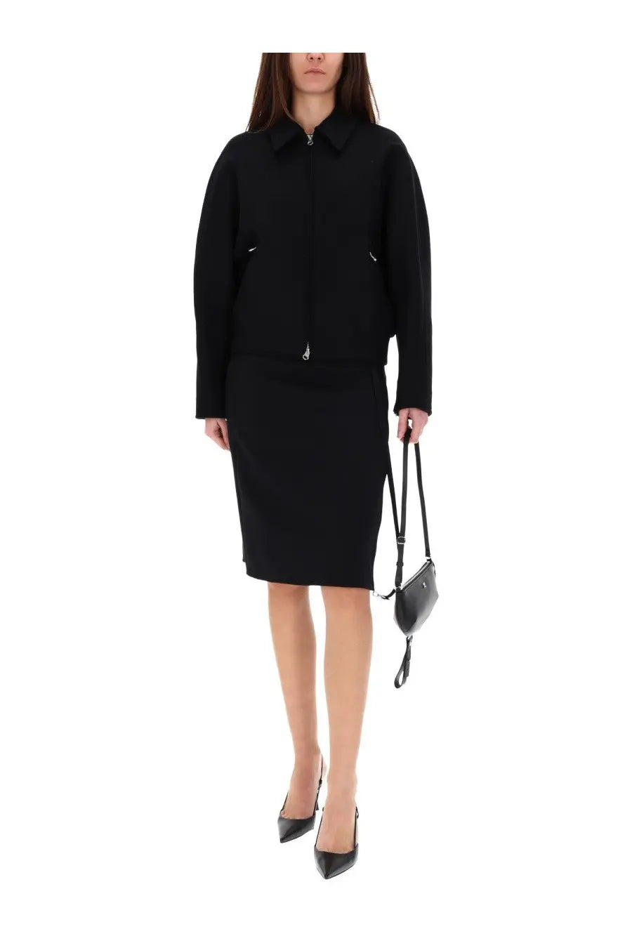 Black leather mini bag with sleek curved design and short strap paired with courrèges women’s black wool bomber jacket