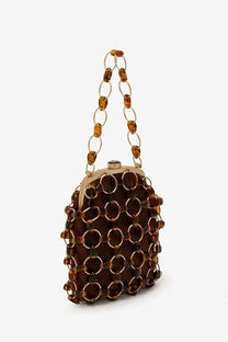 Cult Gaia women’s brielle wristlet leather handbag beige with brown tortoiseshell chain link gold rings amber beads