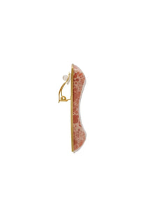Cult Gaia women’s clip earring with a gold-toned setting and a smooth curved pink coral-like stone with marbled patterns