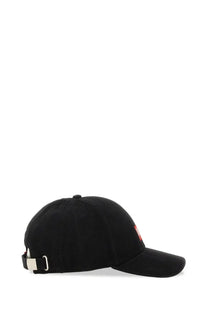 Black corduroy diesel men’s baseball hat with small red logo on side and silver buckle at back shown from rear view