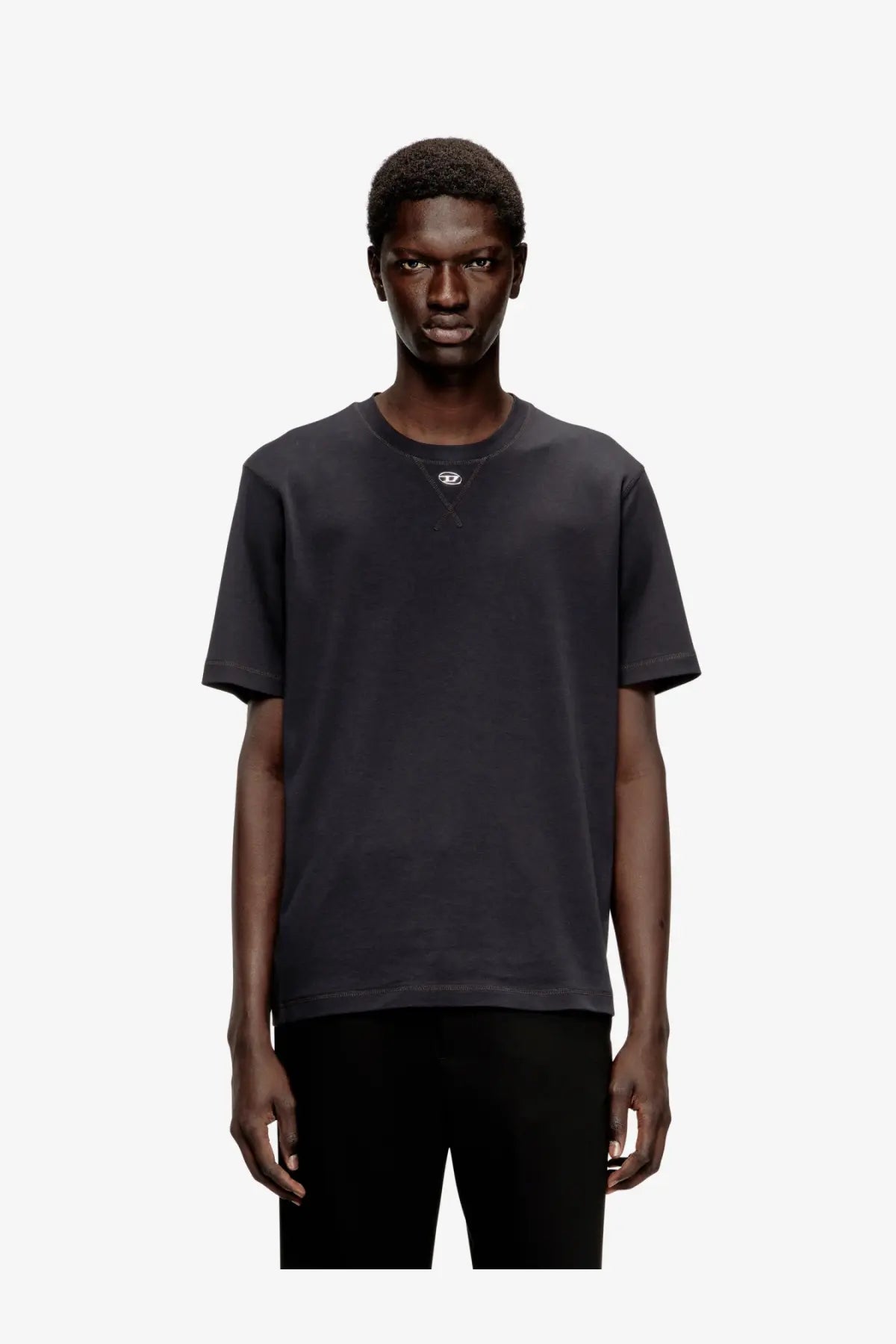 Diesel men’s black cotton blend crewneck t shirt with a small white logo on the left chest